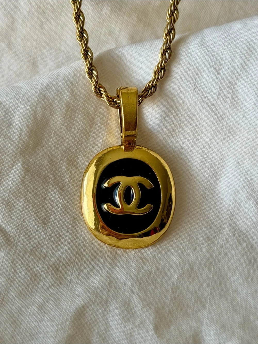 CHANEL Gold and Black Oval CC Pendant Necklace on Rope Chain